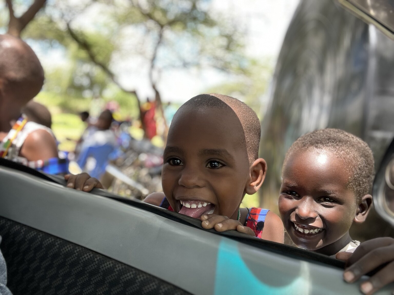 Two children sharing a joyful moment in Kenya