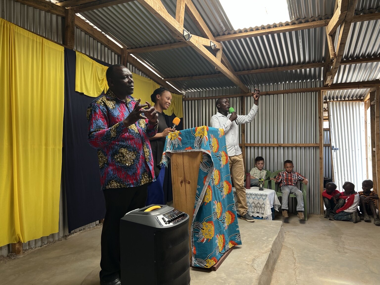 Local ministers teaching and speaking at a church gathering in Kenya